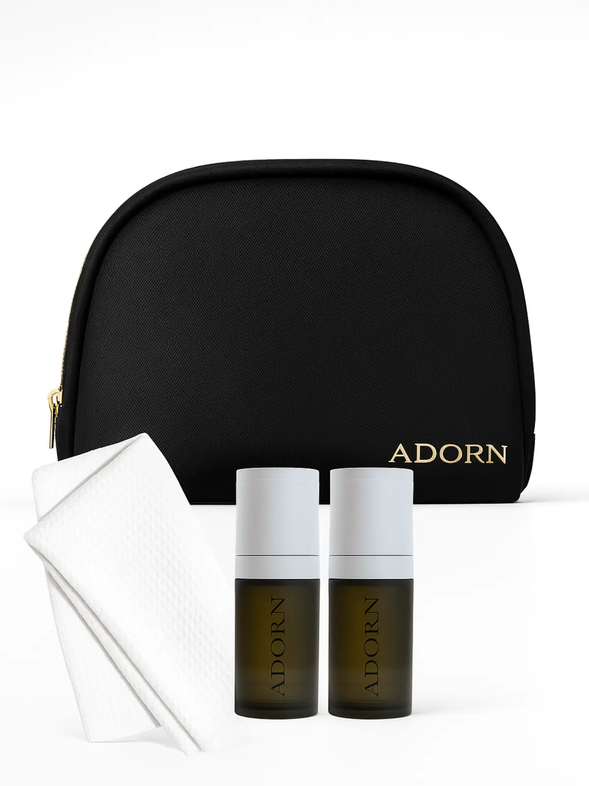 Black 'ADORN' cosmetic bag with two bottles and a pouch on a white background