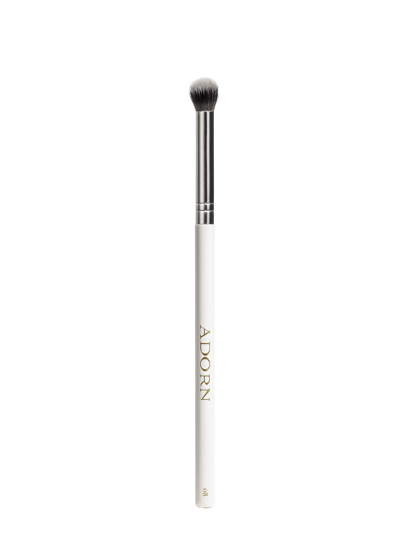 Vegan eyeshadow makeup brush with 'Adorn' branding on a white background