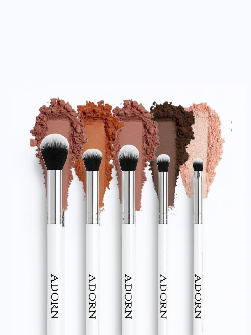 Makeup brush set with 'ADORN' branding and color swatches on a white background.