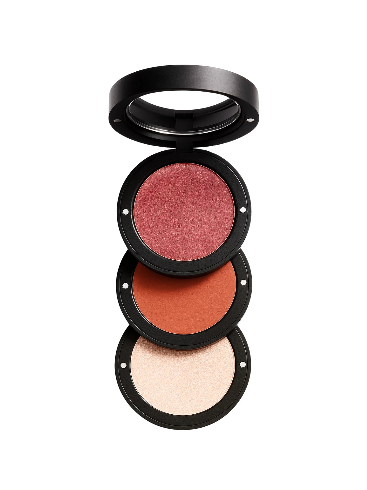 Set of three makeup blushes in different shades on a white background