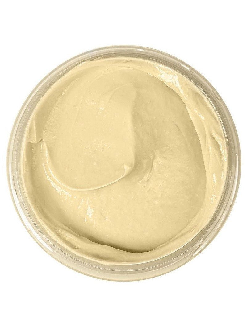 Yellow natural clay mask in a round container on a white background.