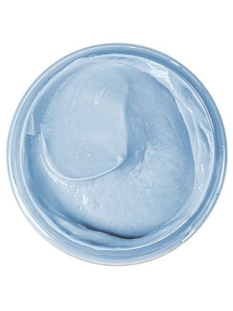 Blue natural clay mask for mature skin in a round container on a white background.