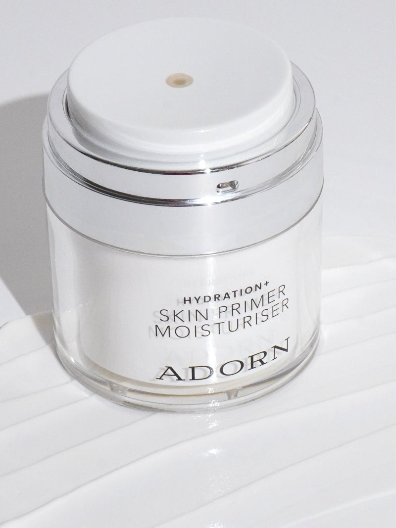 makeup primer for mature skin jar on a creamy gray background.