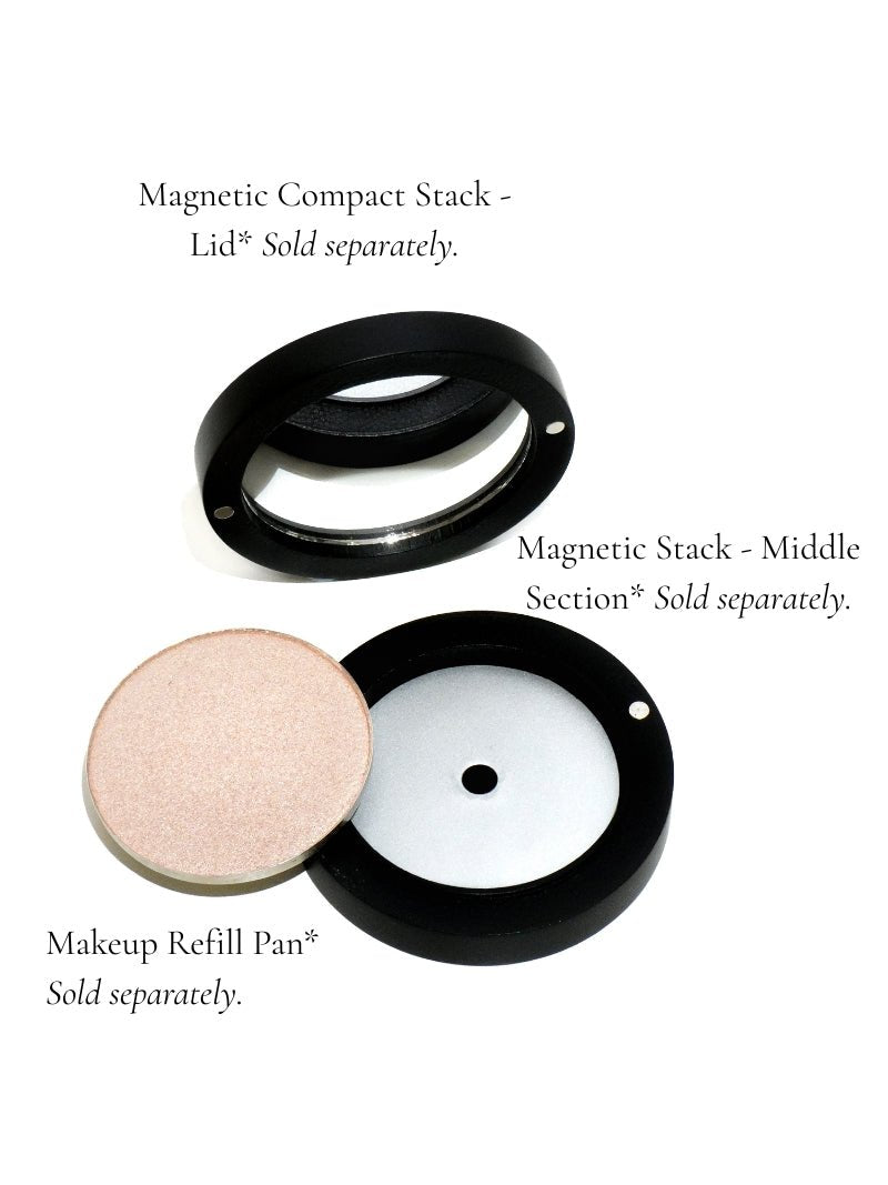 Mineral makeup compact stack parts featuring mirror lid, middle section and makeup refill pan on a white background. Shop from Adorn Cosmetic online.
