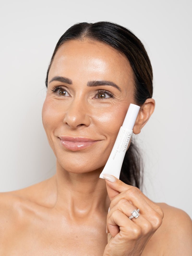 Natural Volumising Eye Lash Primer being held by a woman