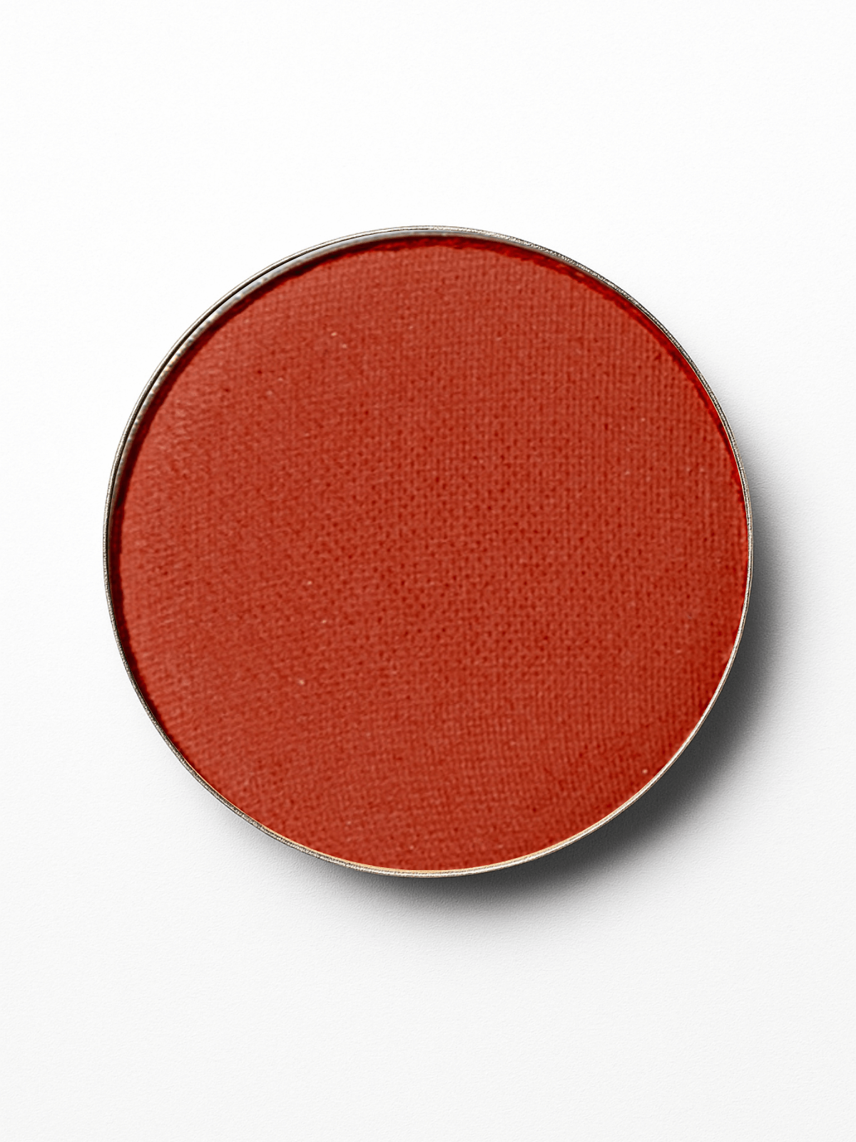 Round red-brown makeup compact on a white background