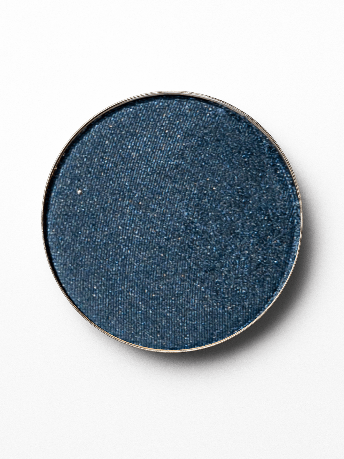 Round blue eyeshadow compact on a white background