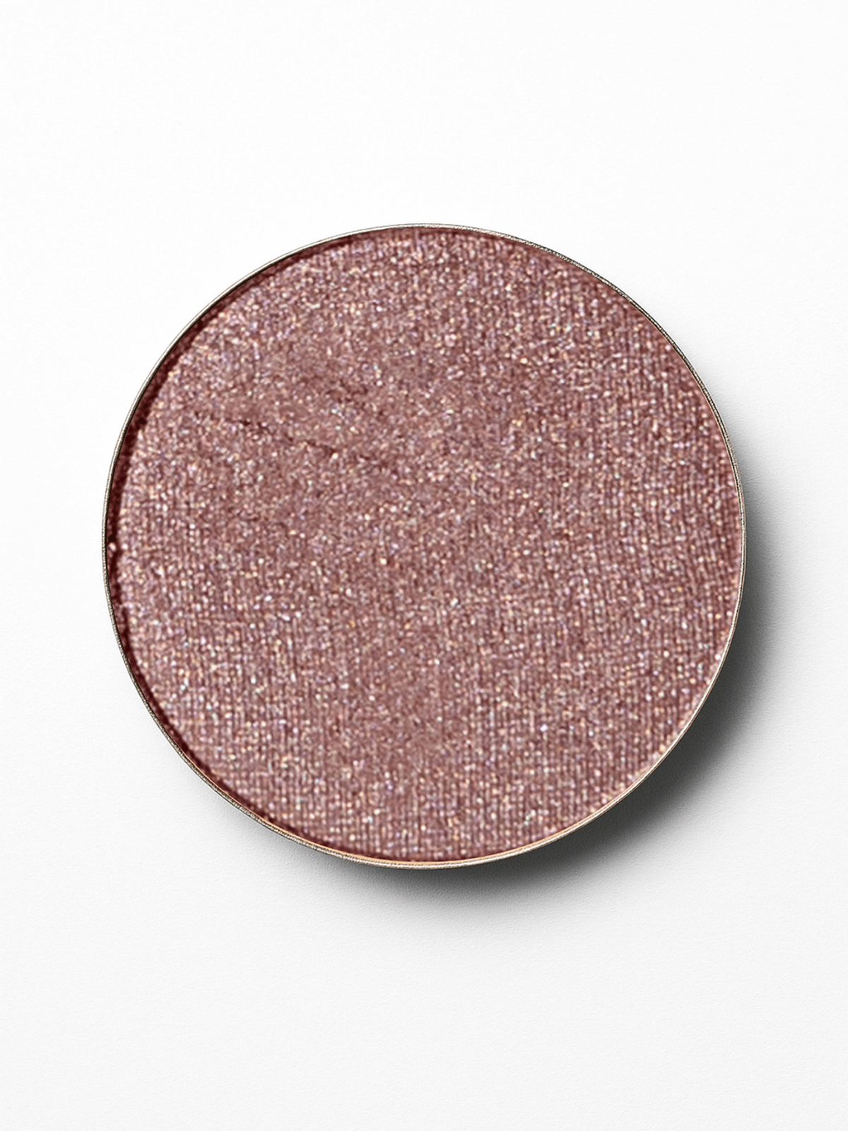 Round makeup compact with a pinkish-brown color on a white background