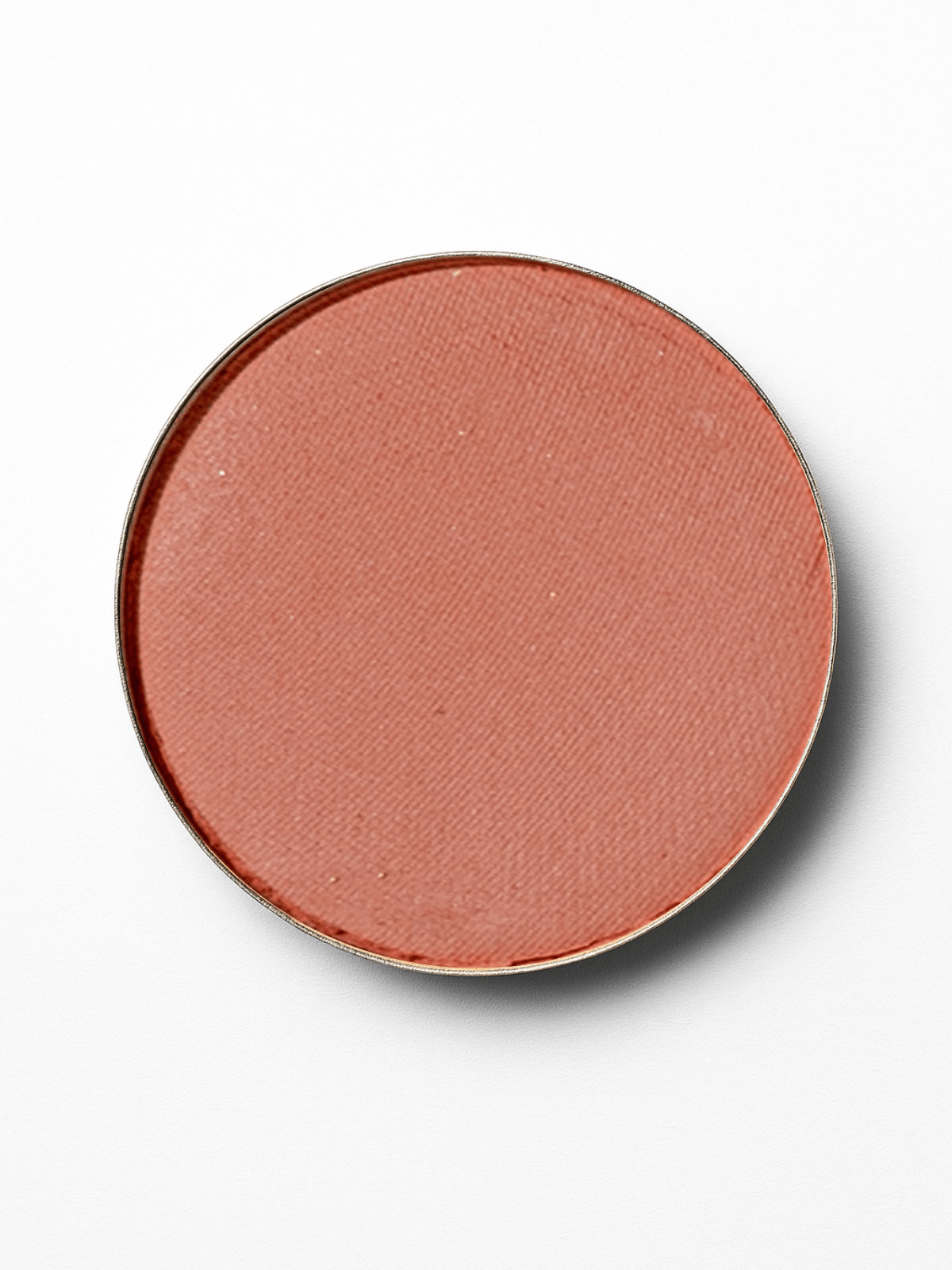 Round blush compact with a pinkish-brown shade on a white background