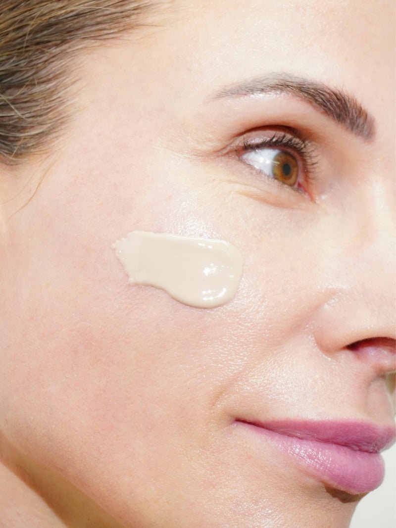 best tinted mineral sunscreen with SPF 50 texture swatch on a woman's face.