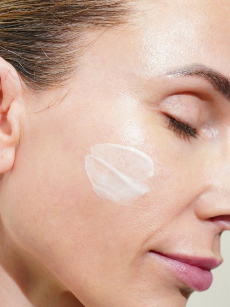 face cream with peptides texture swatch on a model's face.