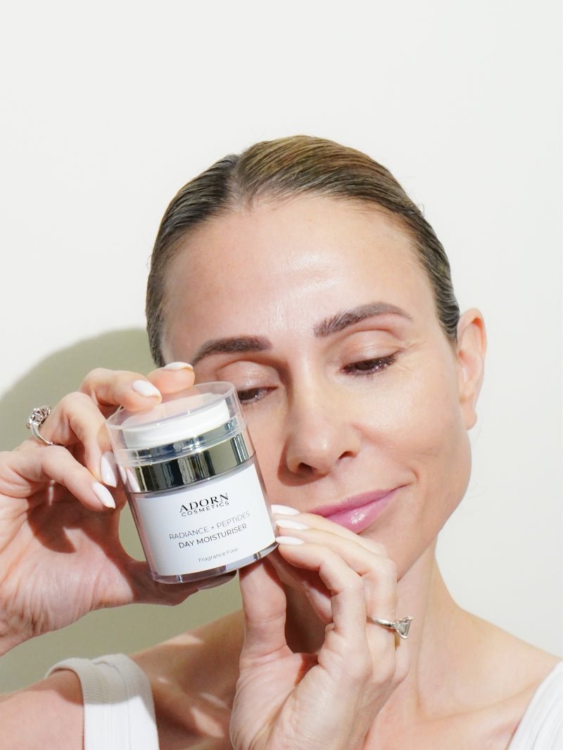 face cream with peptides in model's hands.