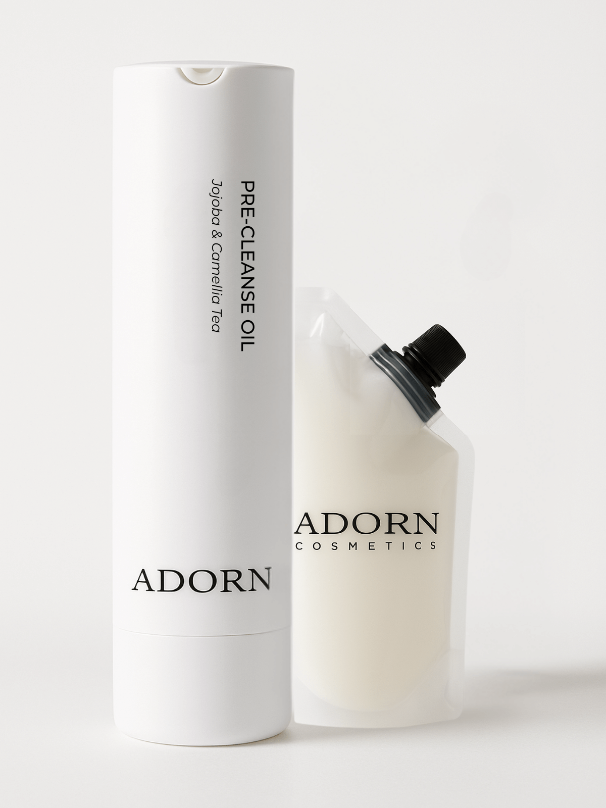 Adorn Cosmetics pre-cleanse makeup removing oil bottle and refill pouch on a white background