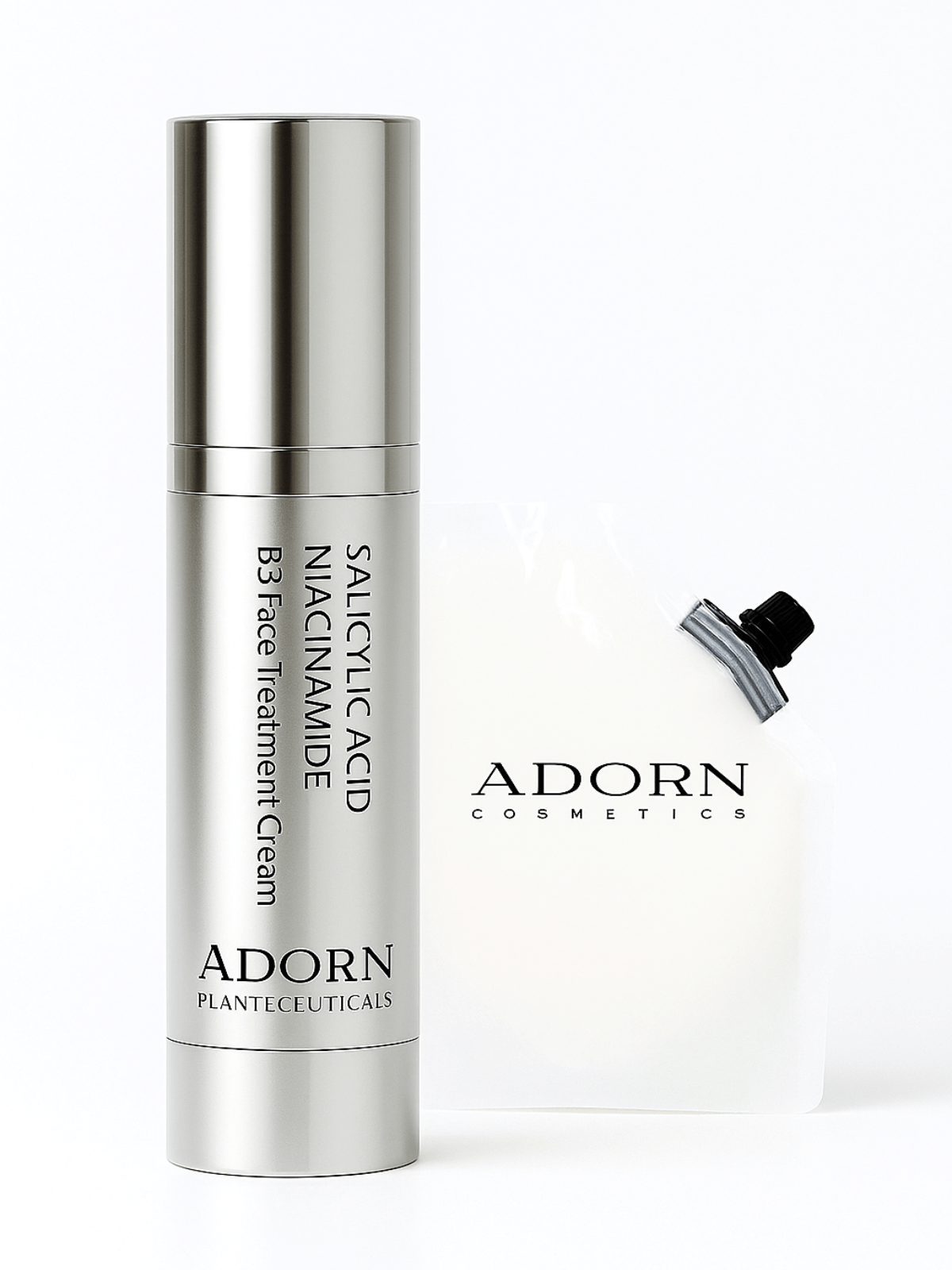 Silver skincare cream bottle with 'Adorn' branding on a white background