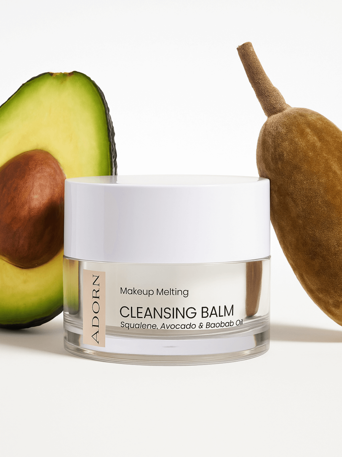 Cleansing balm jar with avocado and sponge on a white background