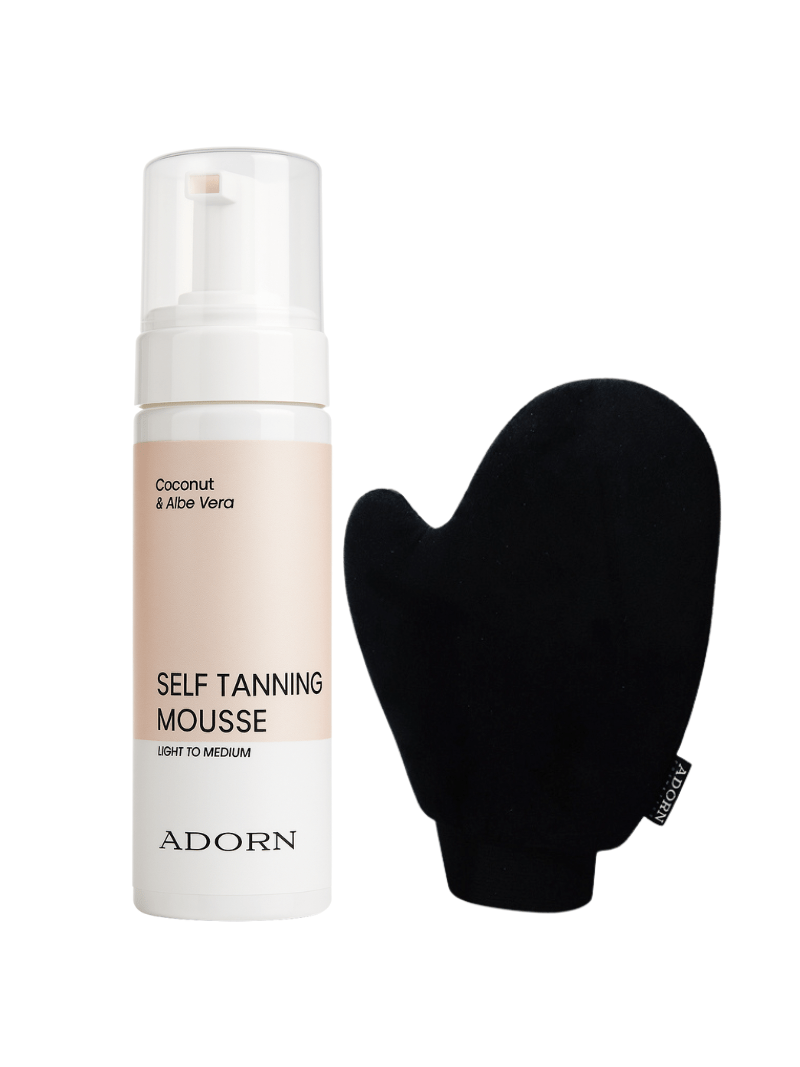 Self-tanning mousse bottle with a black mitt on a white background