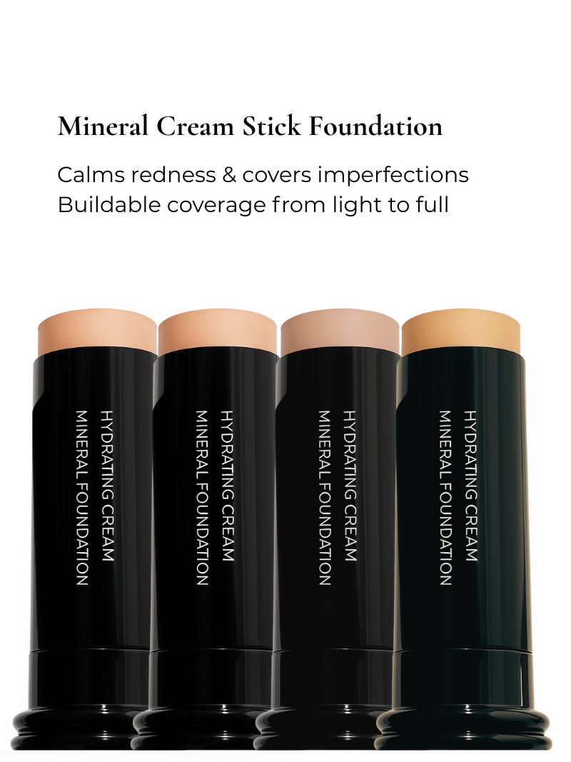 Four mineral cream stick foundations with black packaging on a white background