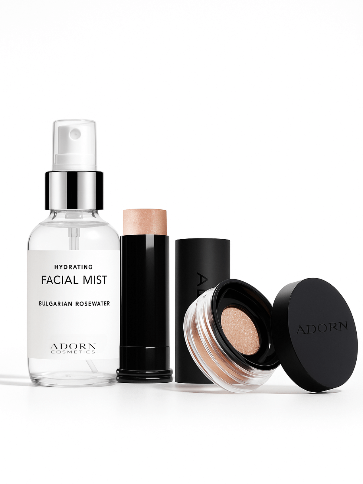 Set of Adorn Cosmetics natural mineral makeup products including a facial mist, cream stick foundation, and mineral powder compact on a white background