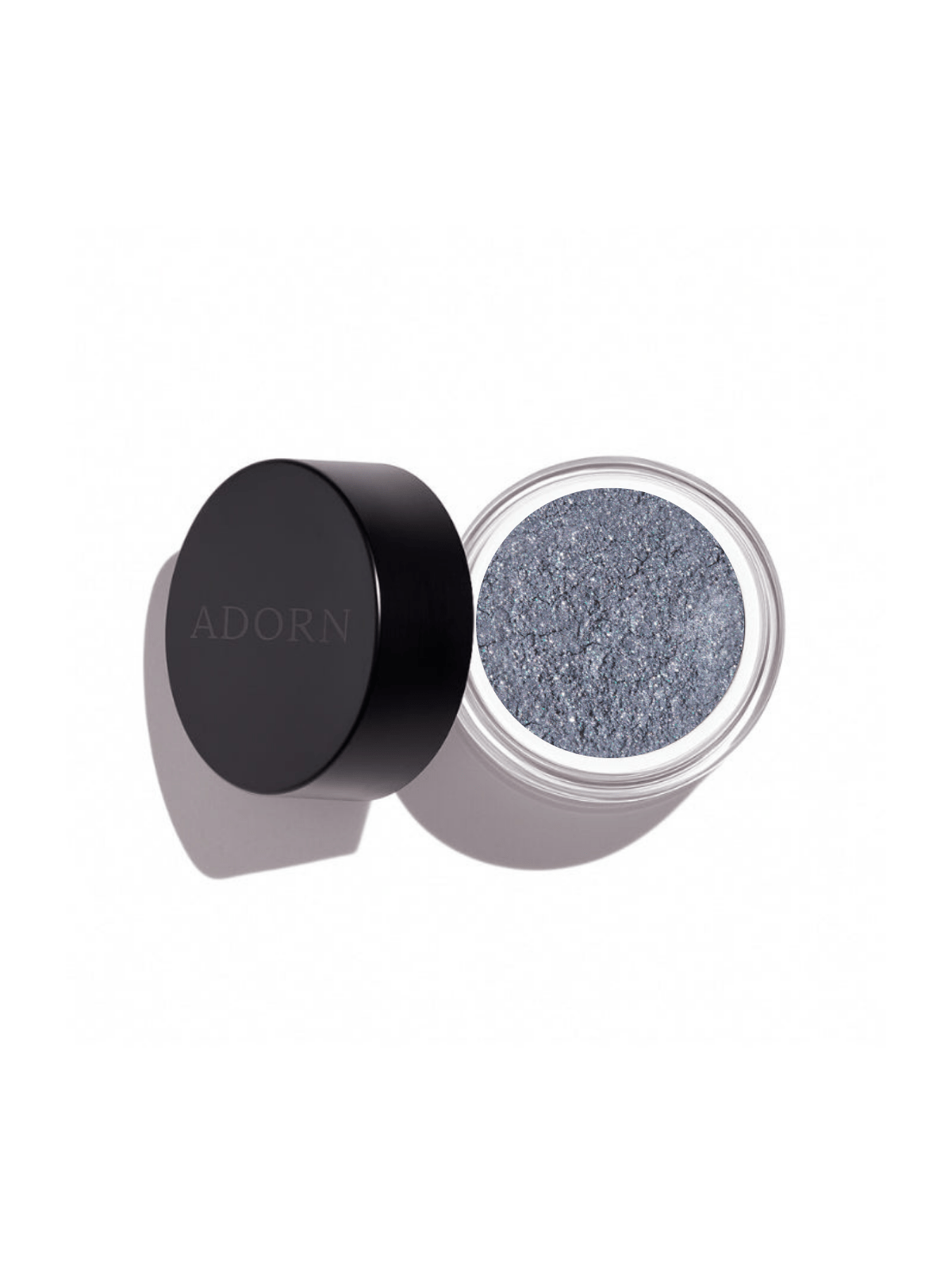 Open container of light grayish, blue loose mineral eyeshadow shade allure powder with 'ADORN' branding on a white background