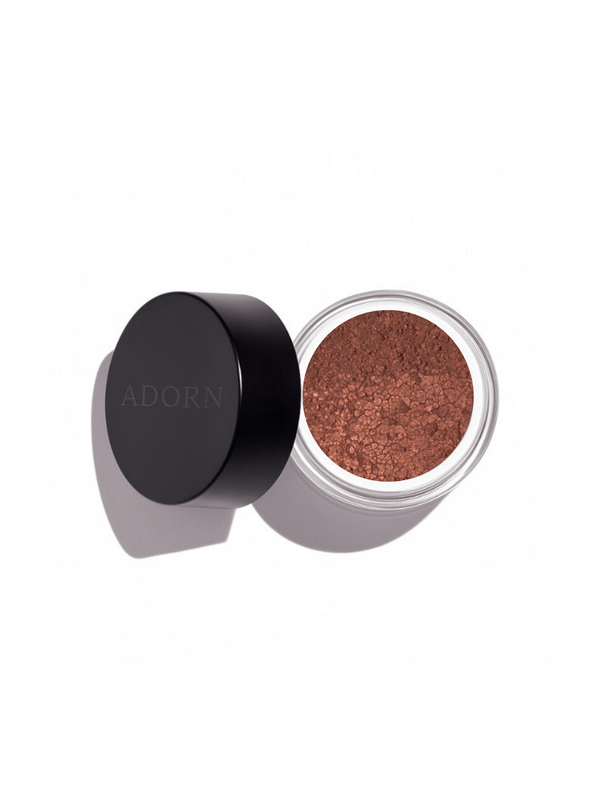 Open container of loose mineral eyeshadow shade copper, shimmer effect with 'ADORN' branding on a white background
