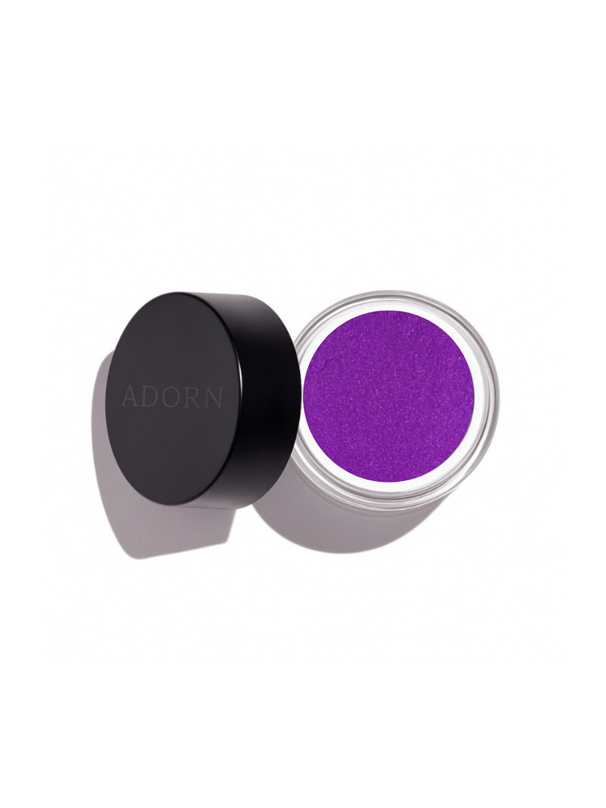 Purple powder loose mineral eyeshadow shade grape in a container with a black lid on a white background, branded 'ADORN'.