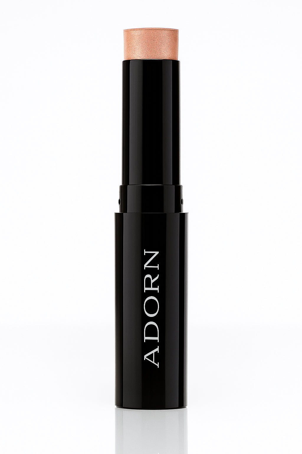 Mineral highlighter stick with 'ADORN' branding on a white background