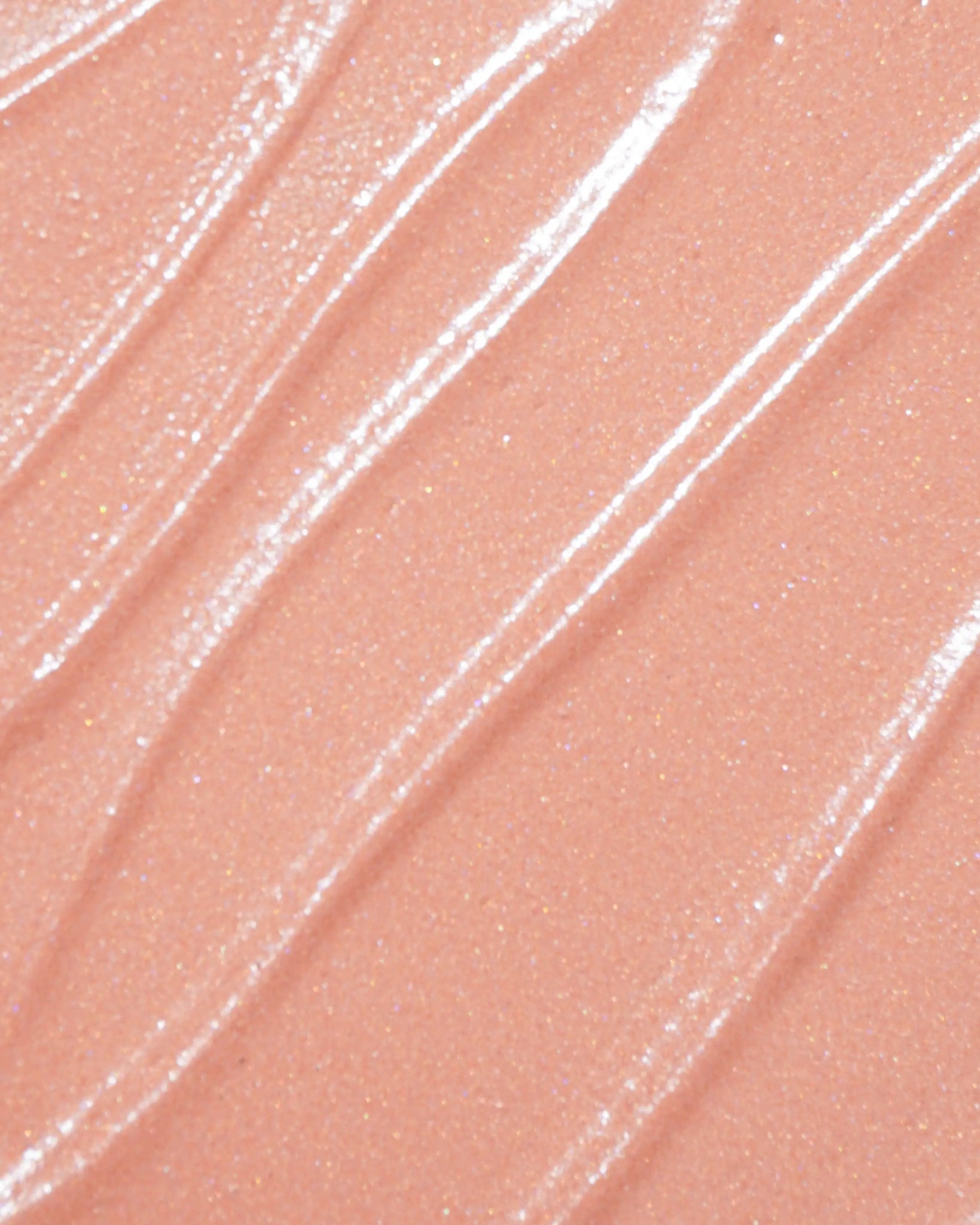 Close-up of liquid blush makeup swatch with a glossy finish