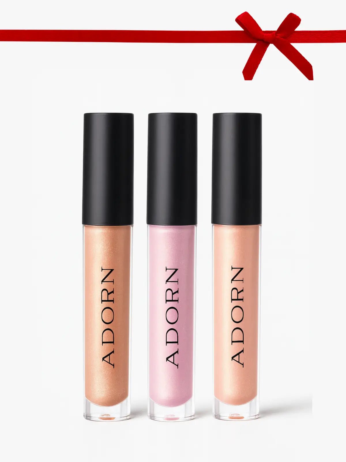 Three lip glosses with 'ADORN' branding on a white background with a red ribbon at the top.