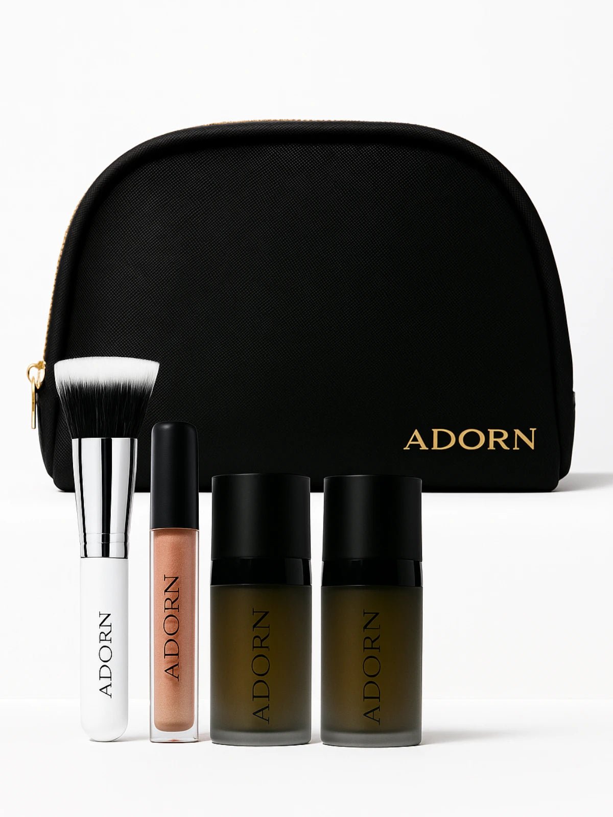 Makeup set with 'ADORN' branding on a black pouch and products.