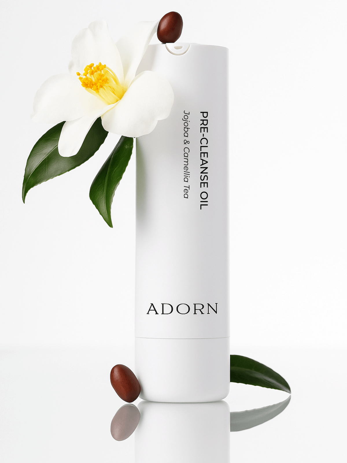 Adorn pre-cleanse makeup removing oil bottle with a white flower and leaves on a white background