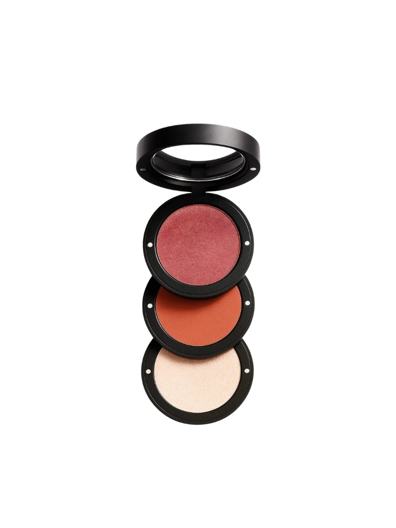 Set of three makeup blushes in different shades on a white background