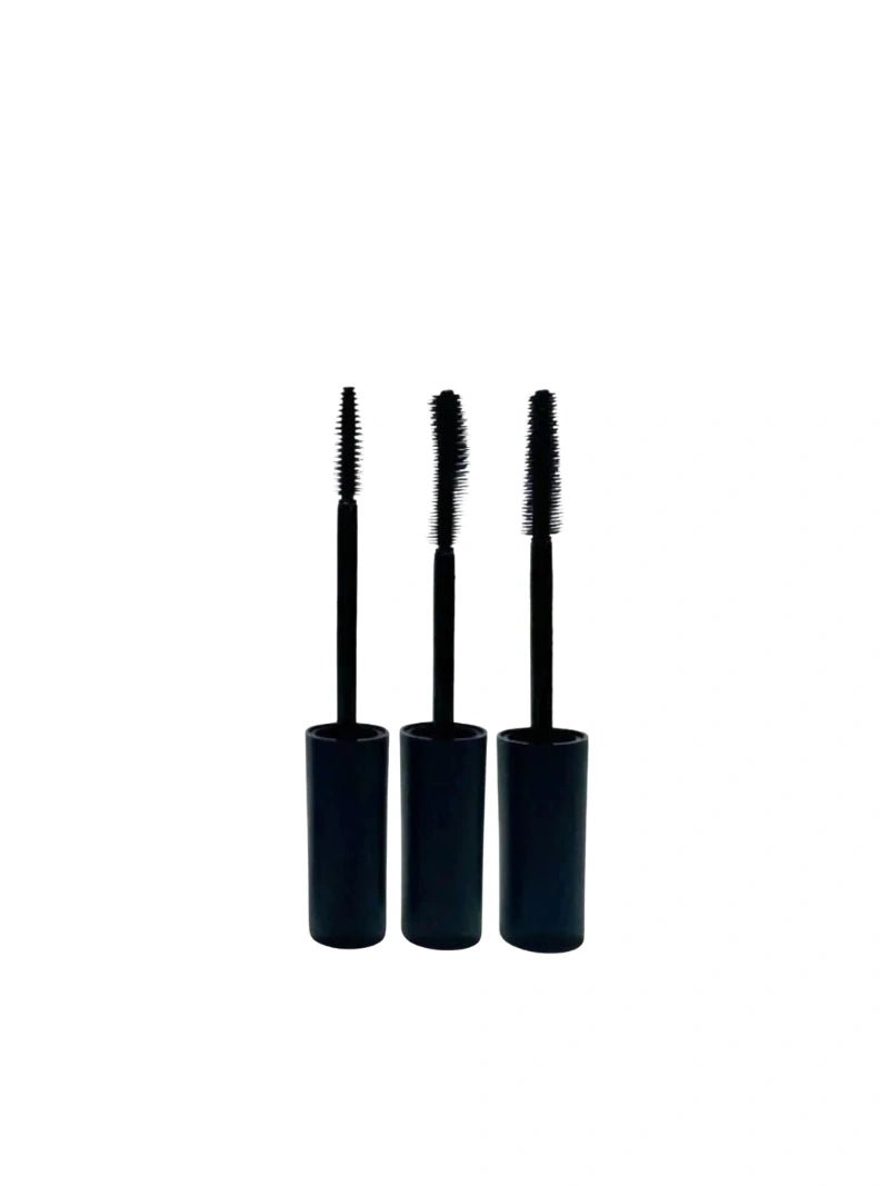 Three black reusable mascara wands with brushes on a white background