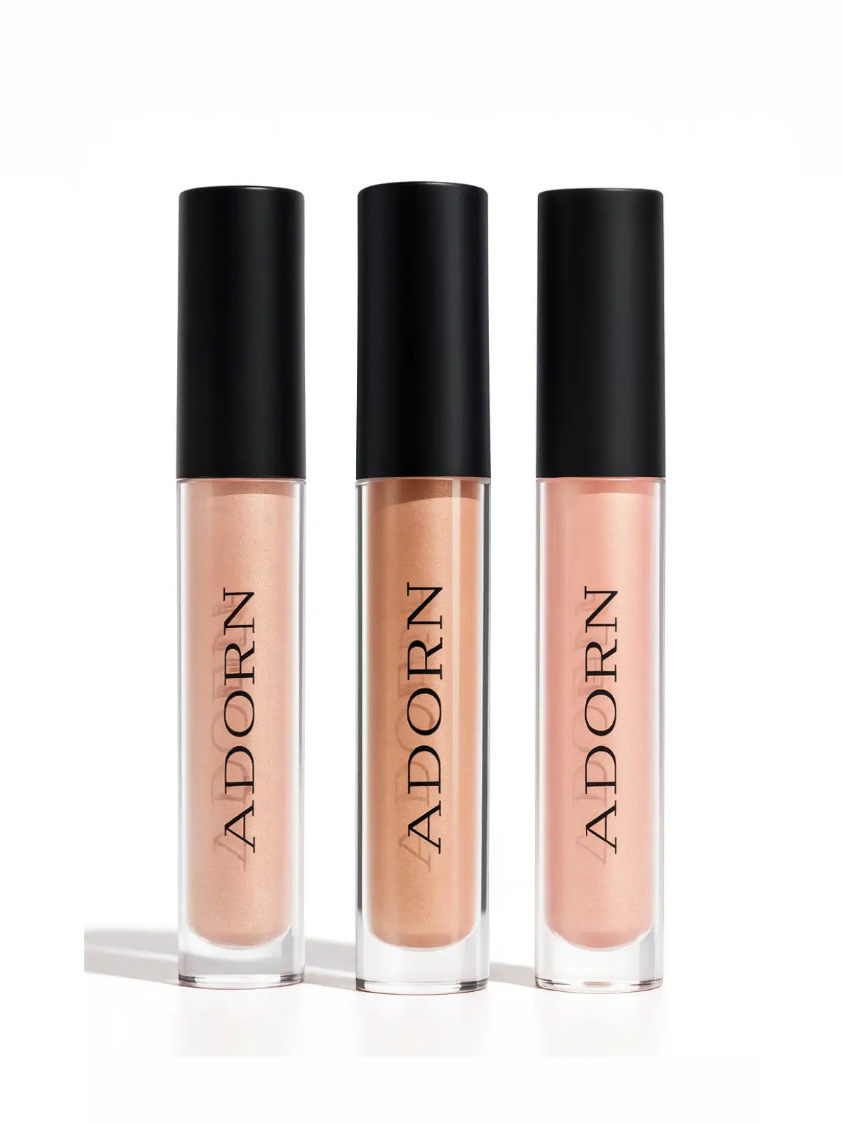 Liquid blush, liquid bronzer and mineral illuminator with 'ADORN' branding on a white background with a red ribbon at the top.