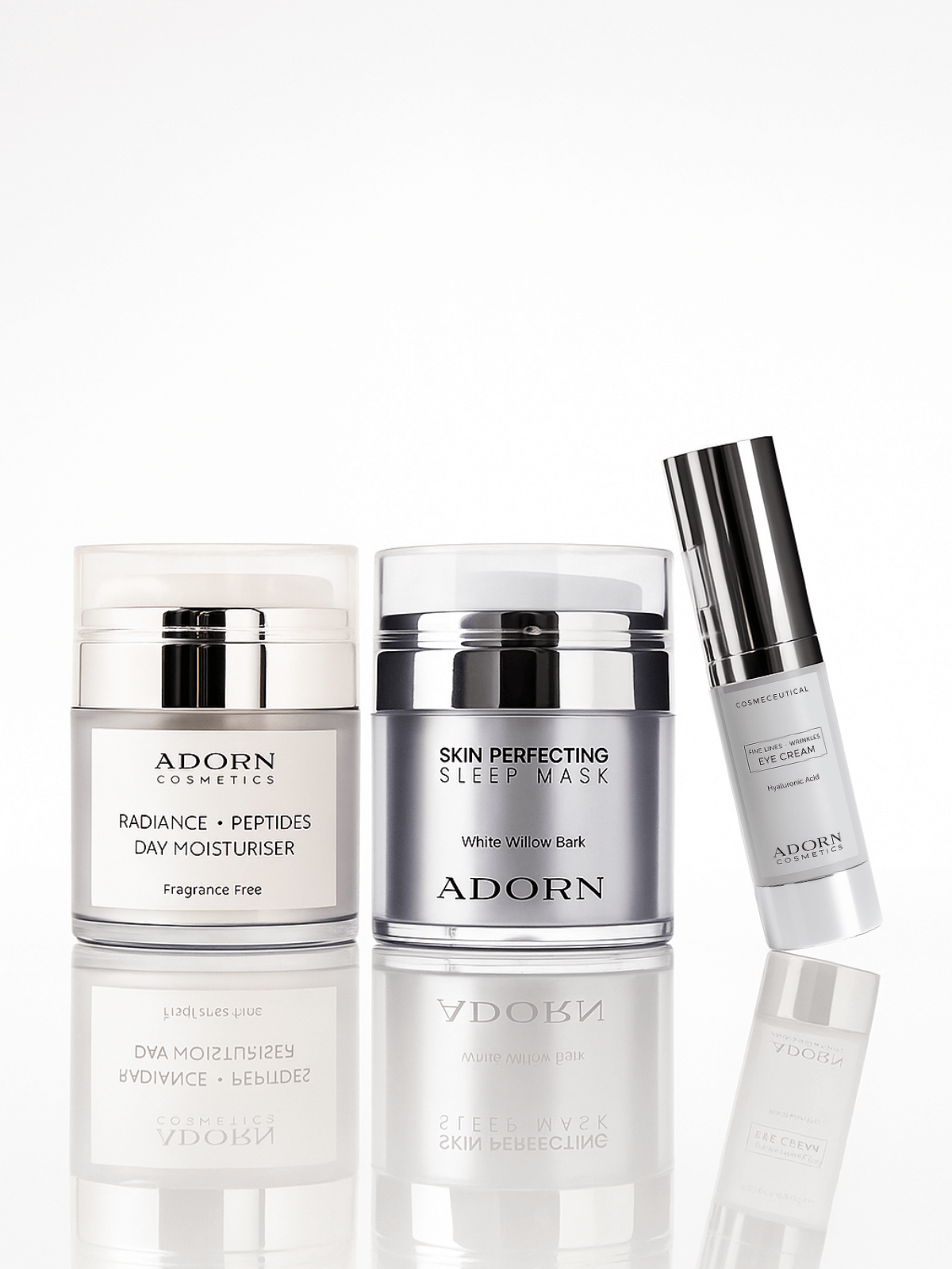 Adorn skincare products including a day moisturiser, sleep mask, and eye serum on a white reflective background.