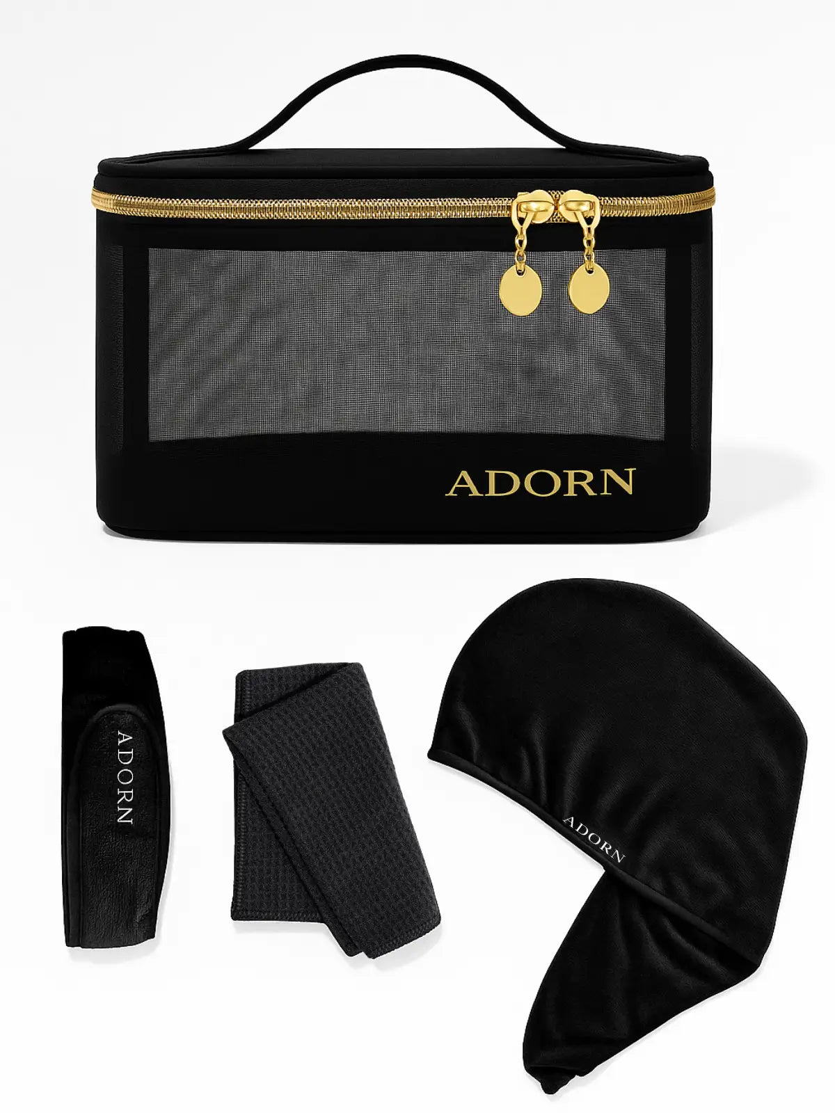 Black cosmetic bag with 'ADORN' branding, accompanied by a headband, hair wrap, and hair cap on a white background.