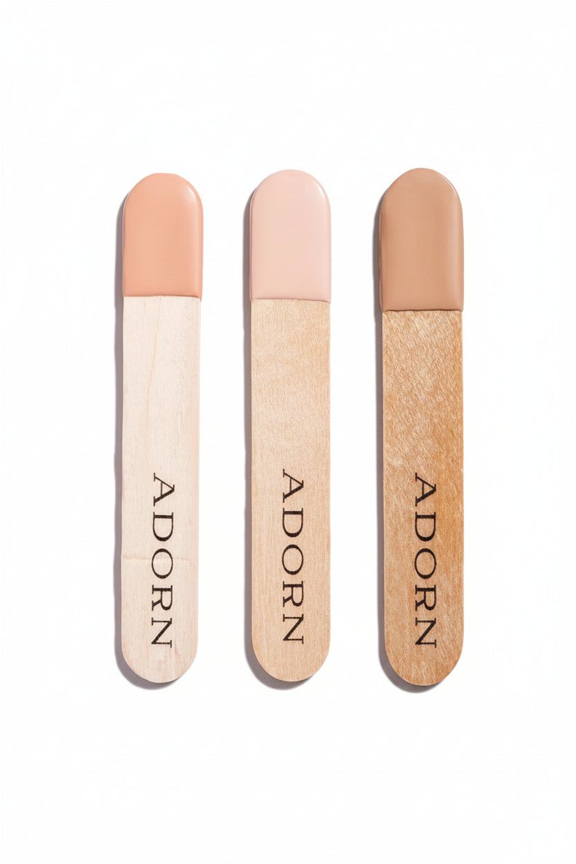 Cream concealer samples in three shades — light, medium olive and medium tan