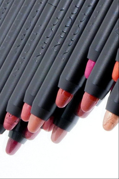 Multi-use mineral makeup crayons showing creamy formula in lip, cheek and eye shades