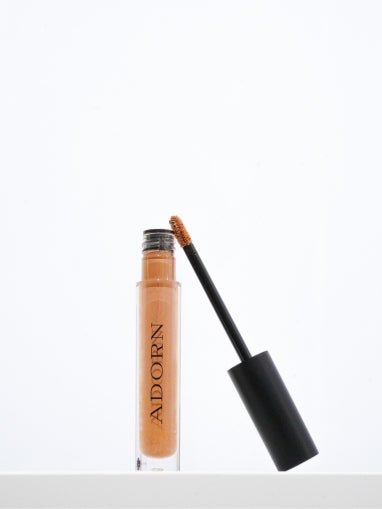 Bronzing liquid beauty product by Adorn Cosmetics