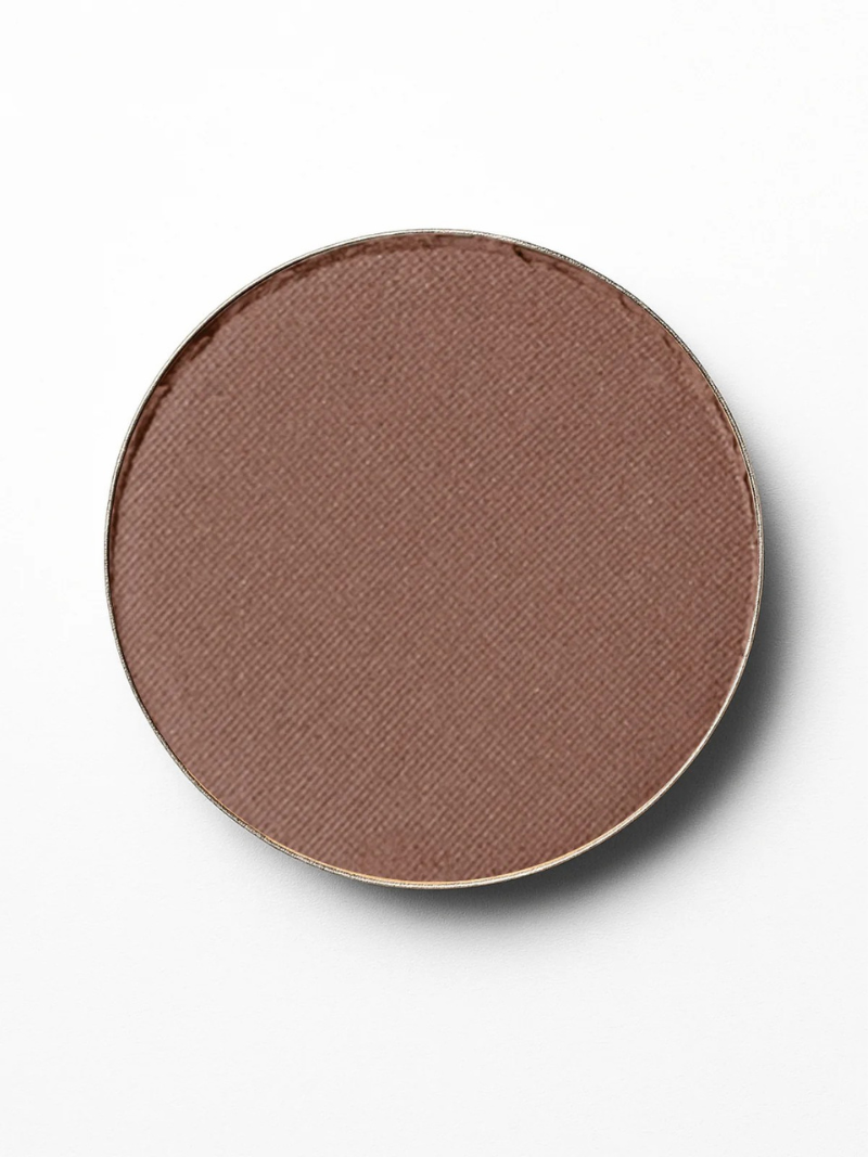 Brown makeup compact on a white background