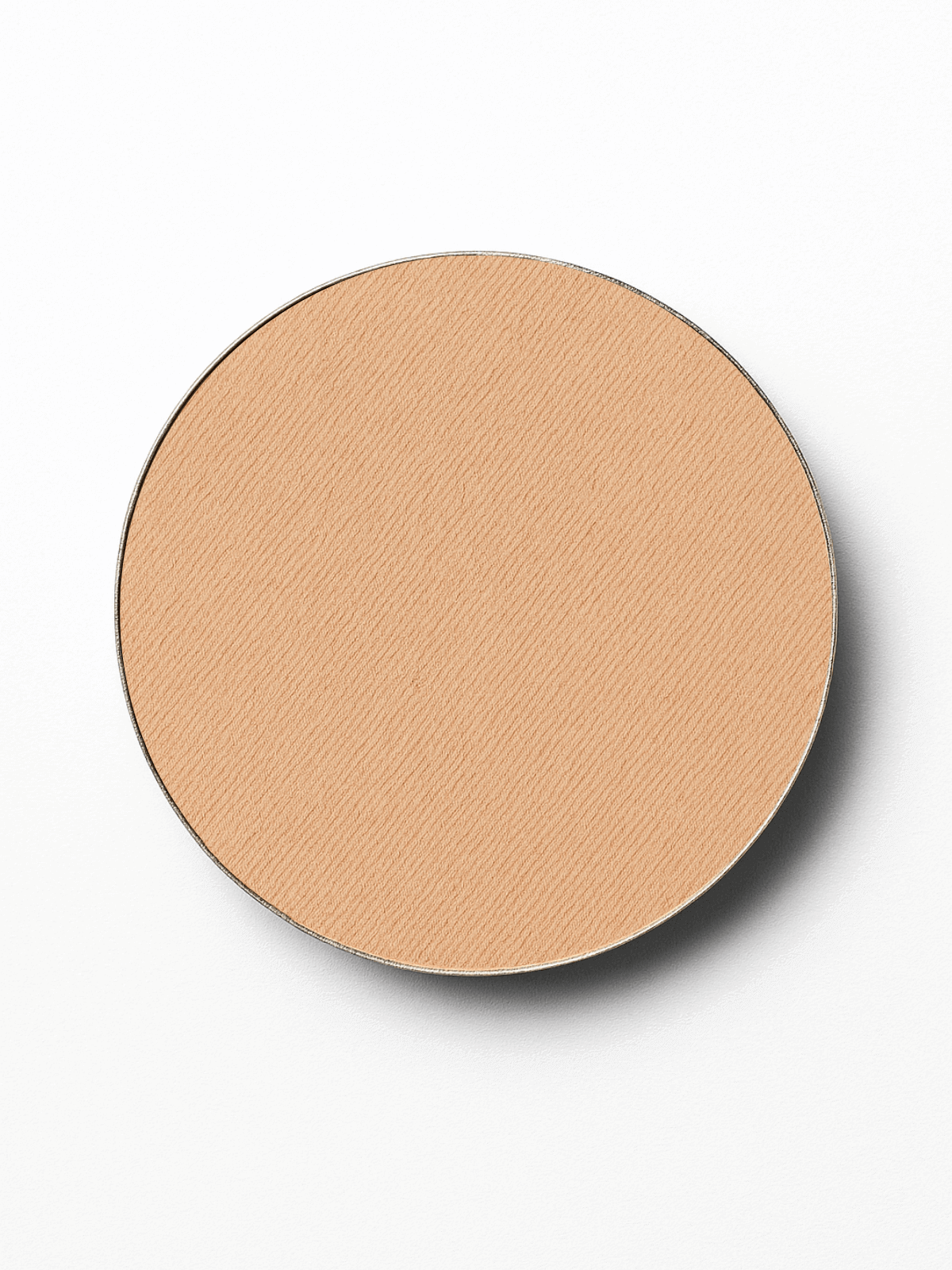 Round pressed mineral foundation refill compact powder on a white background