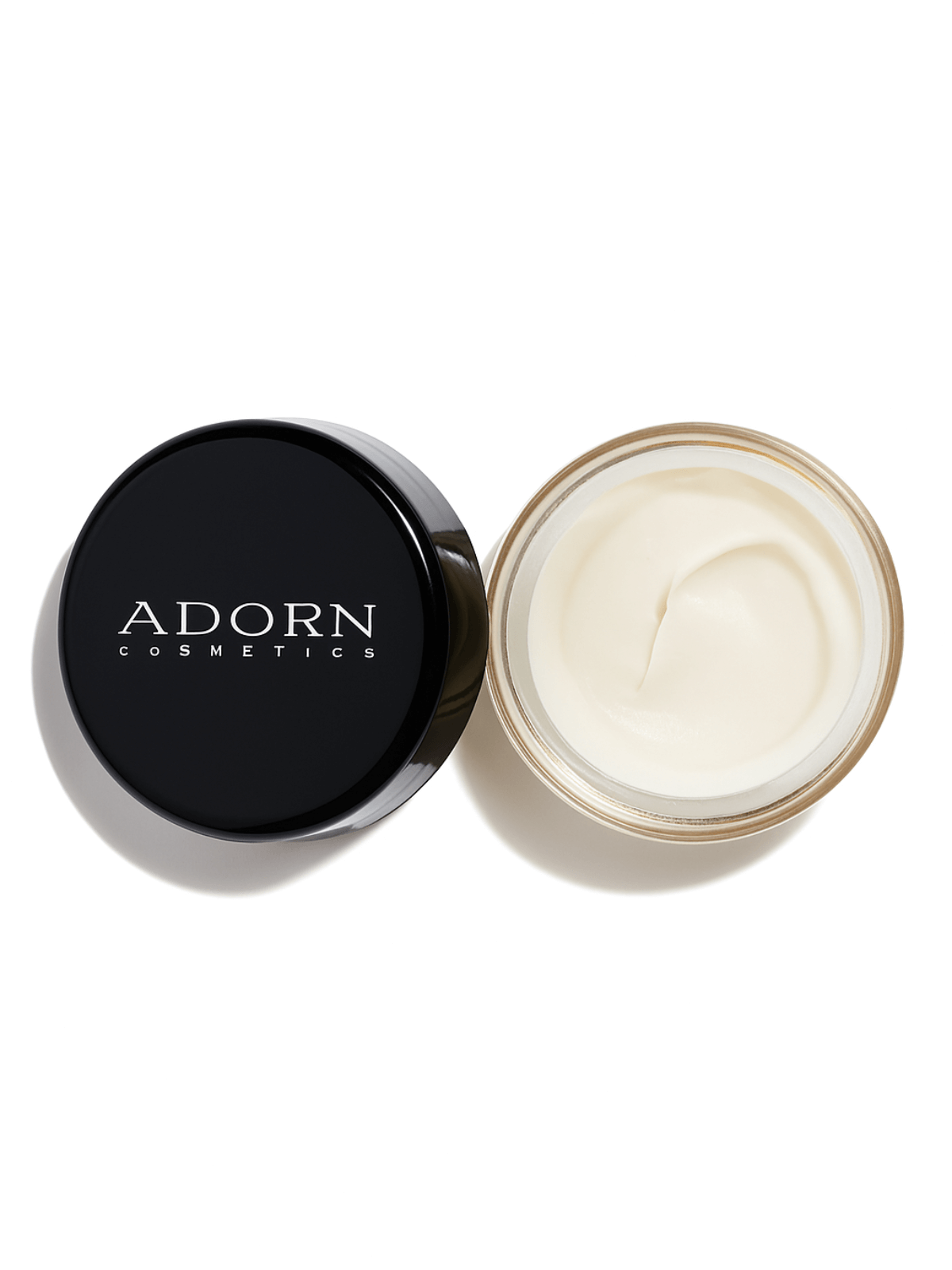 Travel size jar of skin recovery balm from Adorn Cosmetics on a white background.
