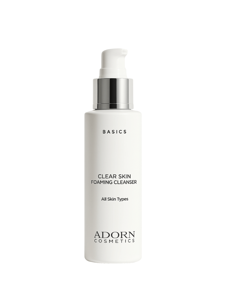 Foaming cleanser bottle labeled 'Basics Clear Skin Foaming Cleanser' by Adorn Cosmetics on a white background