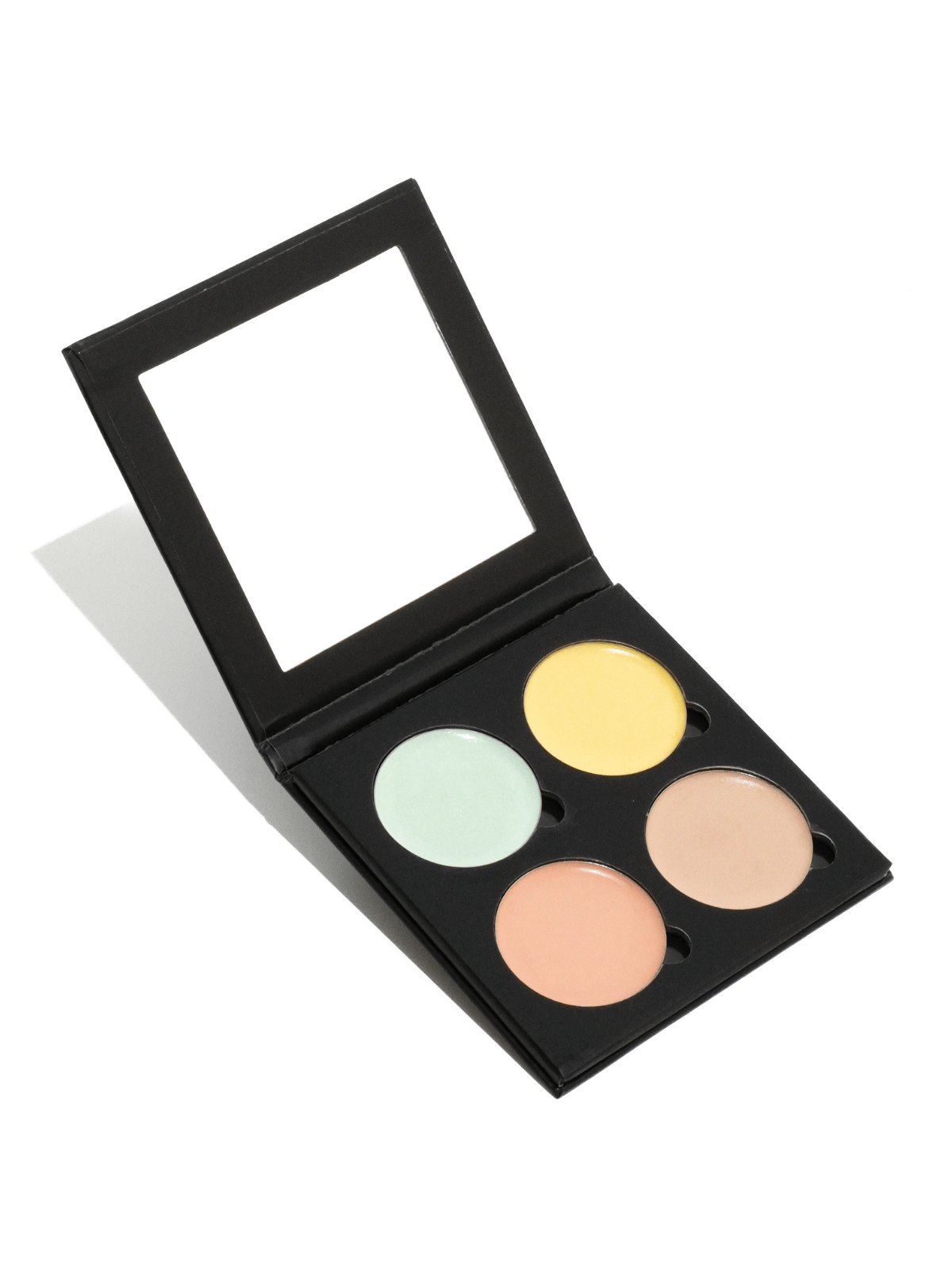corrective concealer palette palette with four colors on a white background