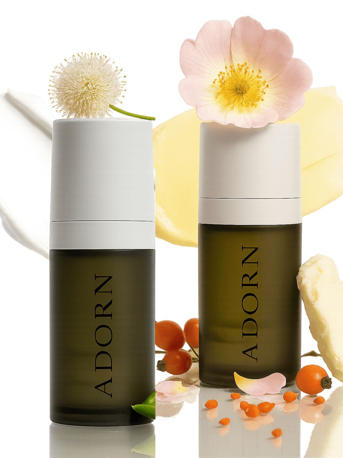 Two 'ADORN' skincare products with flowers and berries on a white background
