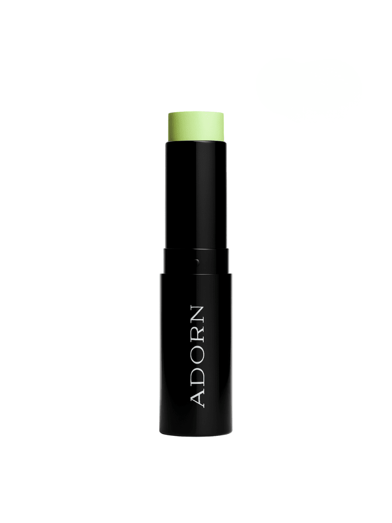 Green colour corrector concealer labeled 'ADORN' on a white background