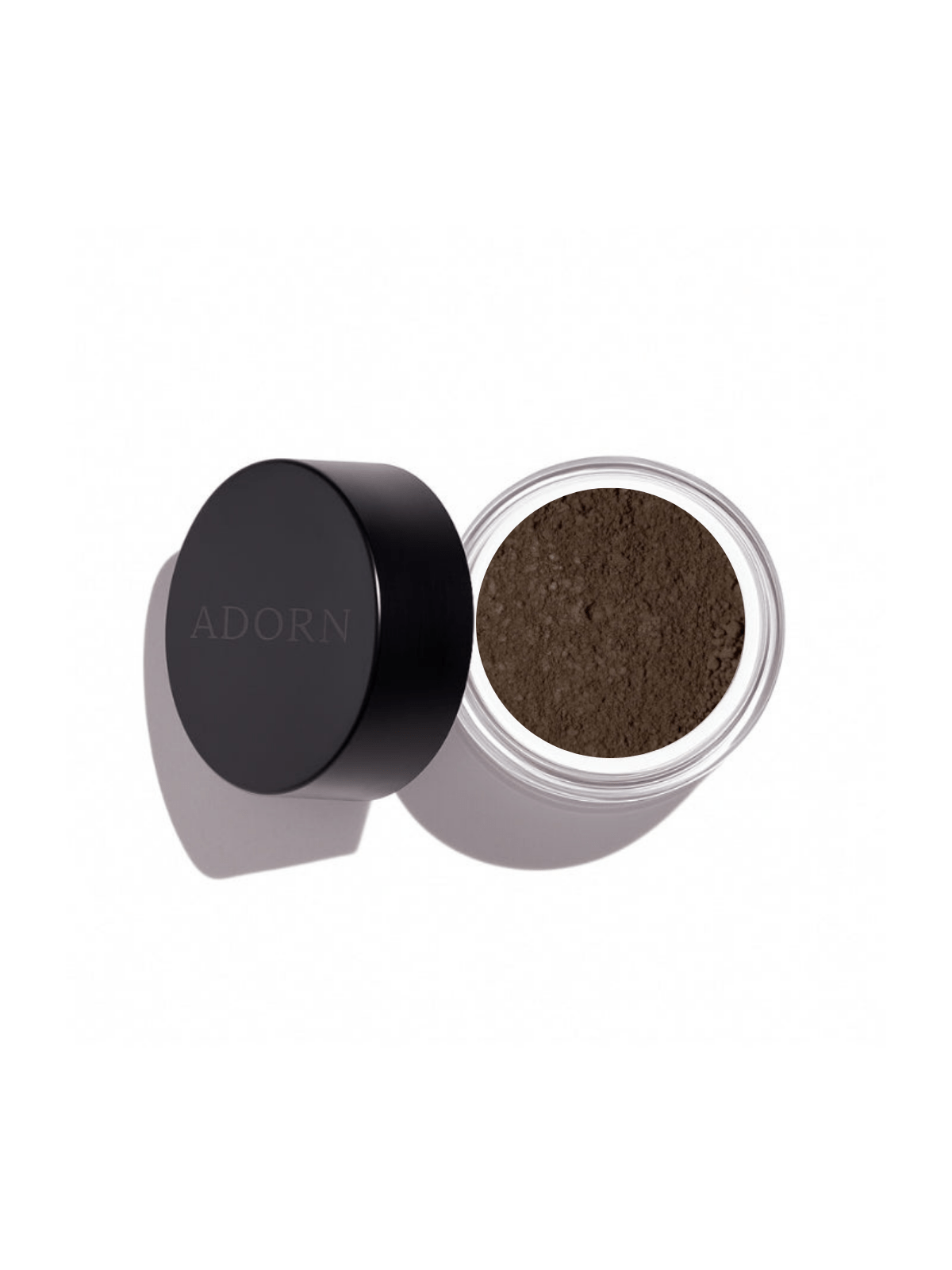 Open jar of loose mineral eyeshadow shade quartz with 'ADORN' branding on a white background