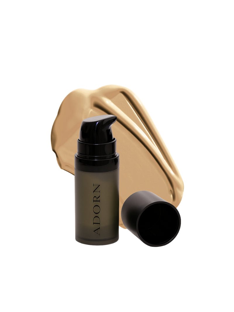 Cosmetic bottle with pump and gold case on a white background