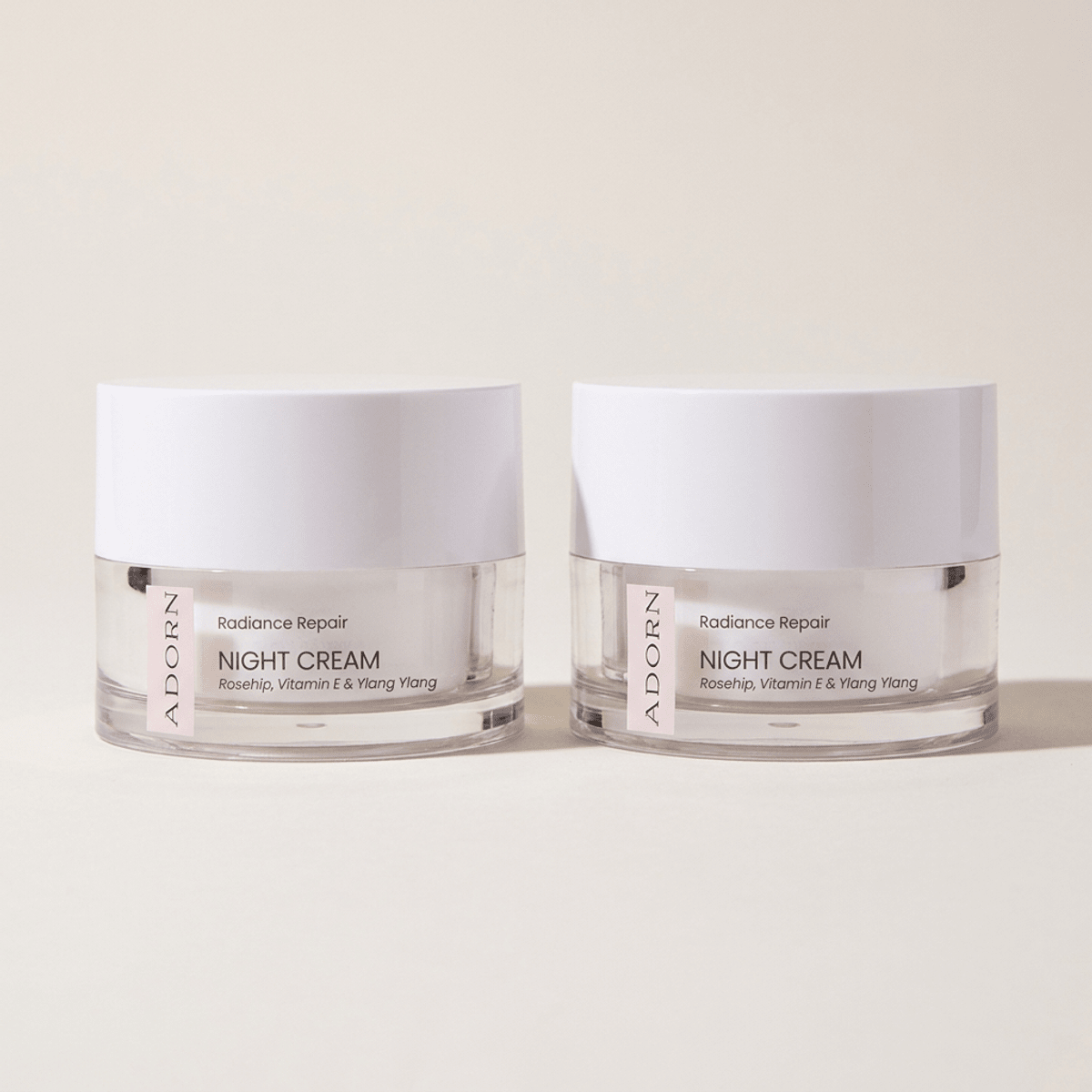 Two Adorn Vitamin E Night Repair Cream jars in the pre-order bundle